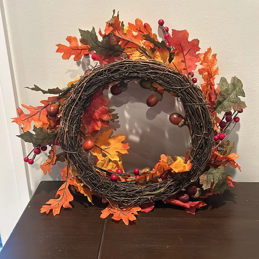 Decorative fall wreath with acorns, berries and leaves. 10” in diameter.